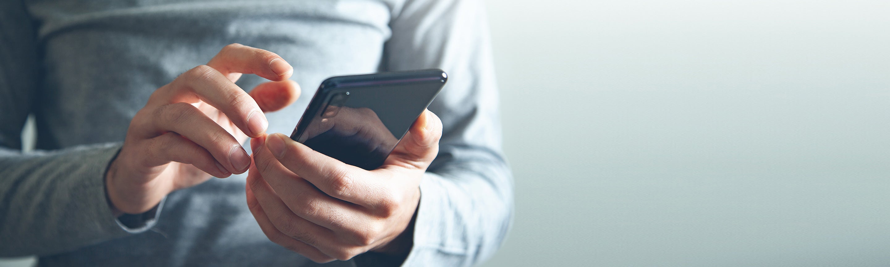 hands holding a smartphone