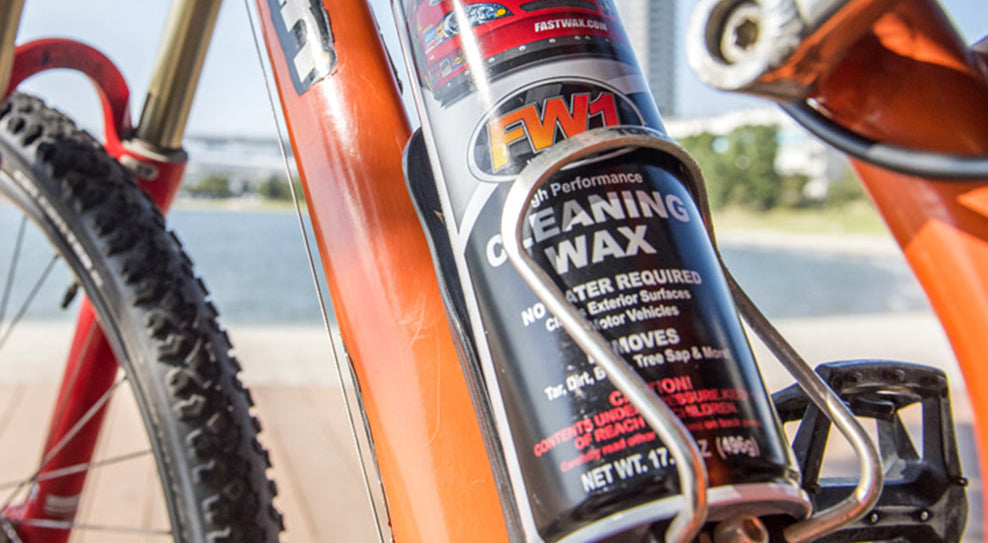 FW1 car wash and wax in a bottle holder on a bike